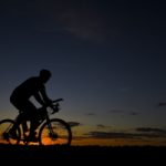 Cyclist riding at sunset