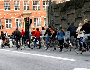 A group of people cycle commuting